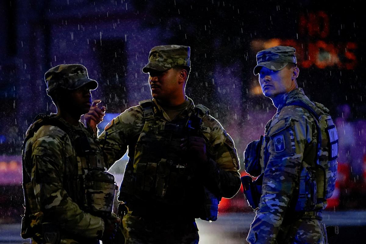 Members of the National Guard stand guard near the White House after a shooting incident in Washington, D.C., U.S., May 23, 2026. REUTERS/Nathan Howard