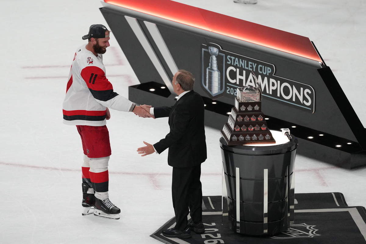 Jun 14, 2026; Las Vegas, Nevada, USA; Carolina Hurricanes center Jordan Staal (11) is awarded the the Conn Smythe Trophy by Commisioner of the NHL Gary Bettman after the win against the Vegas Golden Knights in game six of the 2026 Stanley Cup Final at T-Mobile Arena. Mandatory Credit: Lucas Peltier-Imagn Images