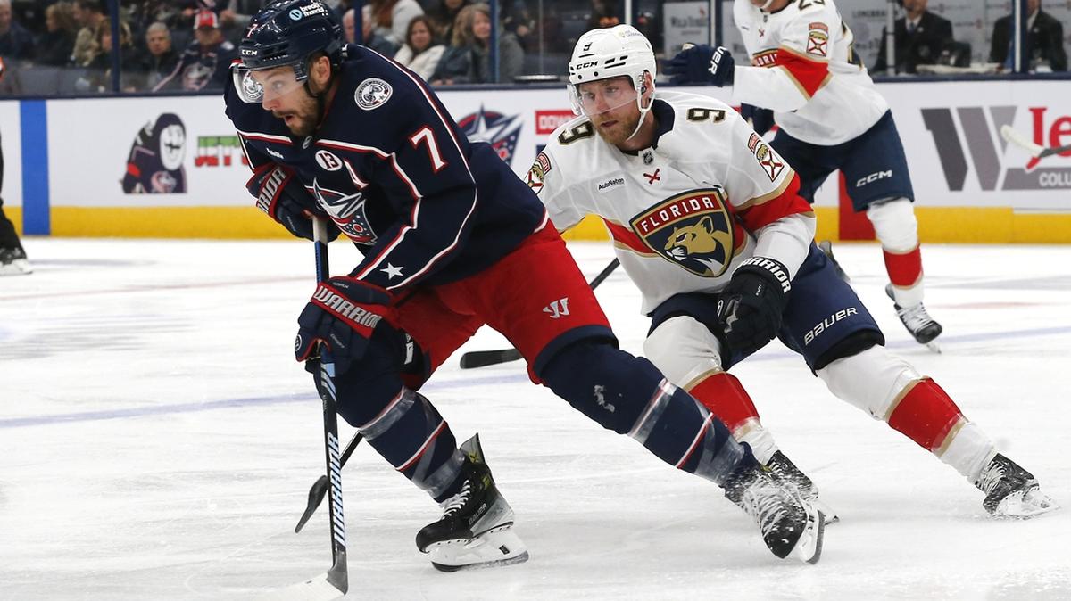 Columbus Blue Jackets center Sean Kuraly (7) controls the puck as Florida Panthers center Sam Bennett (9) defends during the first period at Nationwide Arena.