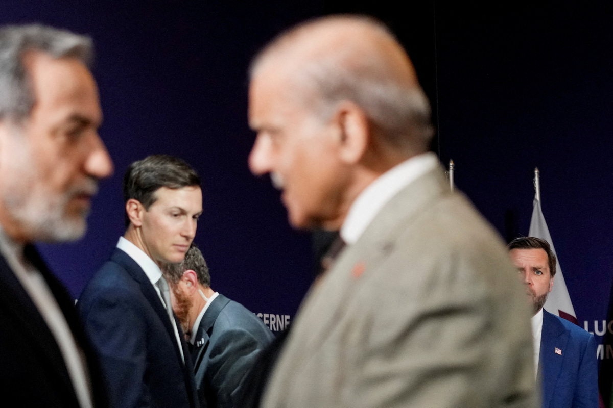 U.S. Vice President JD Vance looks on next to U.S. President Donald Trump's son-in-law Jared Kushner, as Iran's Foreign Minister Abbas Araqchi shakes hands with Pakistan's Prime Minister Shehbaz Sharif, before the start of a quadrilateral meeting between the U.S., Iran, Pakistan, and Qatar at the Lake Lucerne Summit, aimed at advancing a deal to end the Middle East conflict, at Buergenstock Resort Lake Lucerne, near Stansstad, Switzerland, June 21, 2026. REUTERS/Nathan Howard/Pool