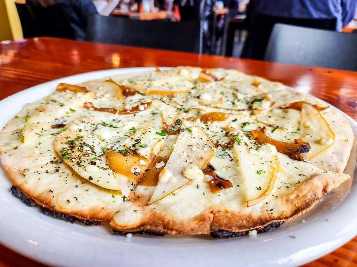  Savor local flavors with a pear and cheese wood-fired pizza at Solstice Wood Fire Pizza Cafe and Bar. Photo credit: June Russell-Chamberlin 