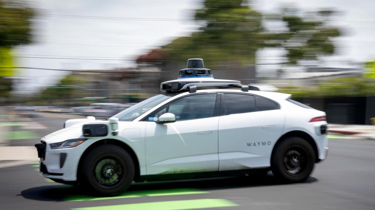 Santa Monica, CA, United States - May 13, 2026: A Waymo vehicle drives down a street on Wednesday, May 13, 2026 in Santa Monica, CA. Waymo has recalled 3,800 autonomous taxis after identifying a bug that allowed the vehicles to drive into standing water, per a letter on the National Highway Traffic Safety Administration's (NHTSA) website (Eric Thayer / Los Angeles Times)
