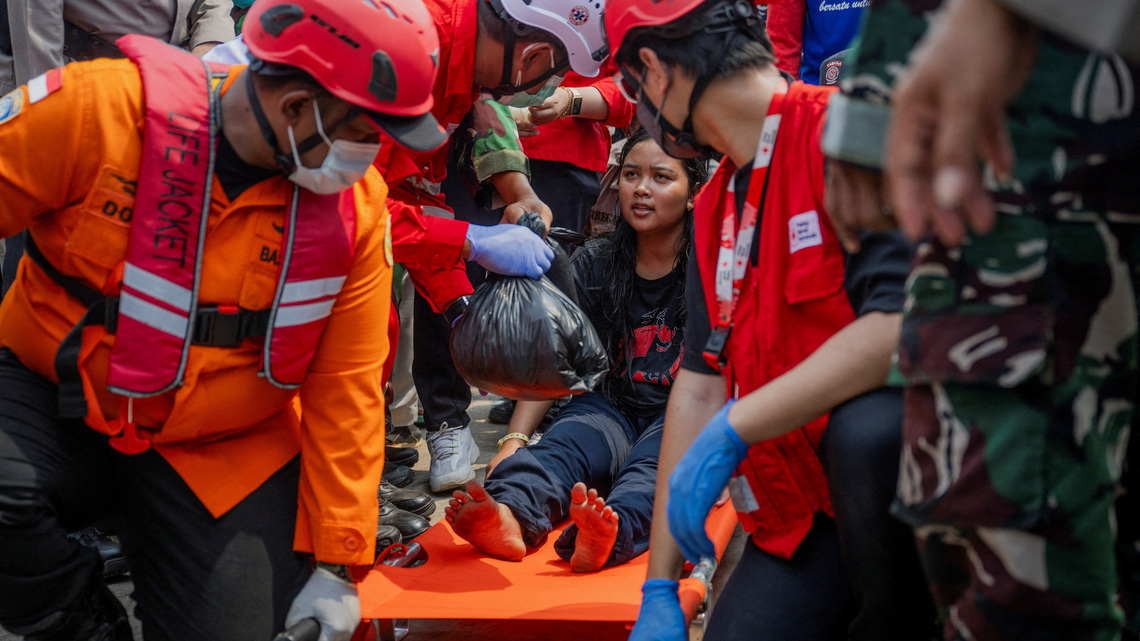 Families desperate for news as 129 still missing four days after capsize of ship in Indonesia's Java Sea 