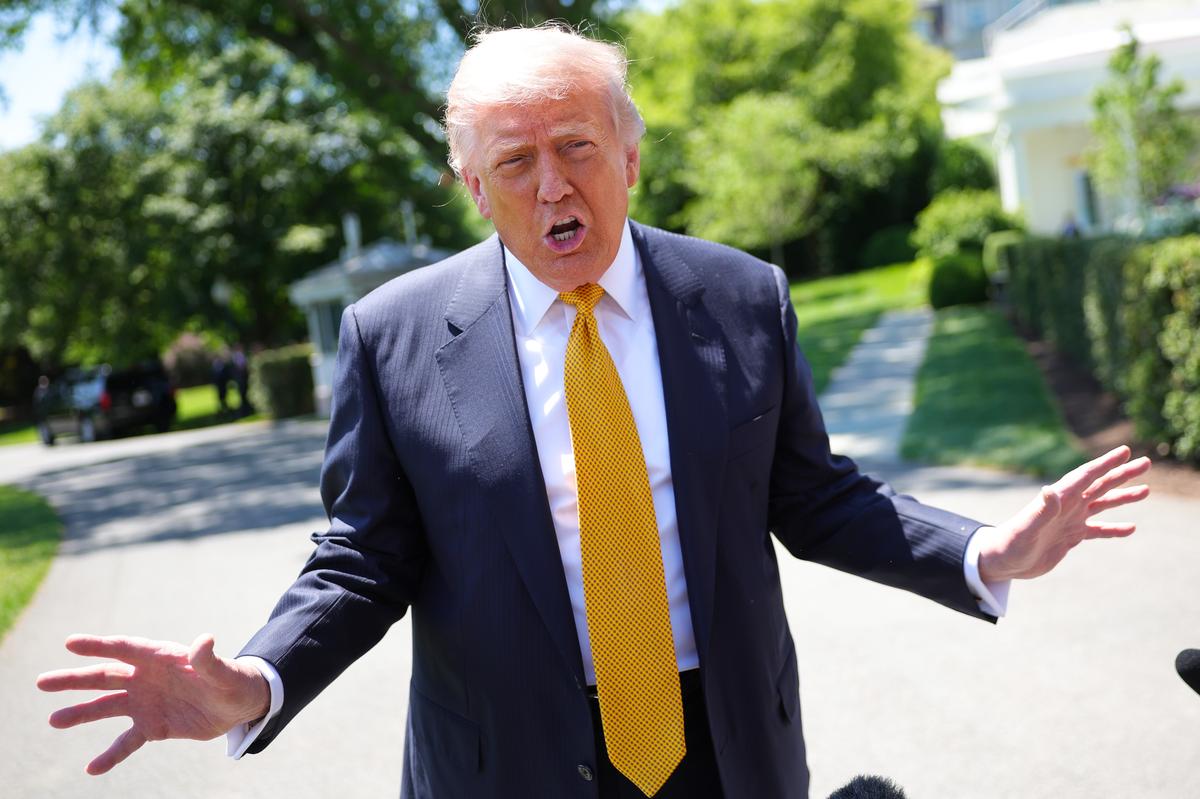  President Donald Trump speaks to the press as he departs the White House on May 12, 2026. 