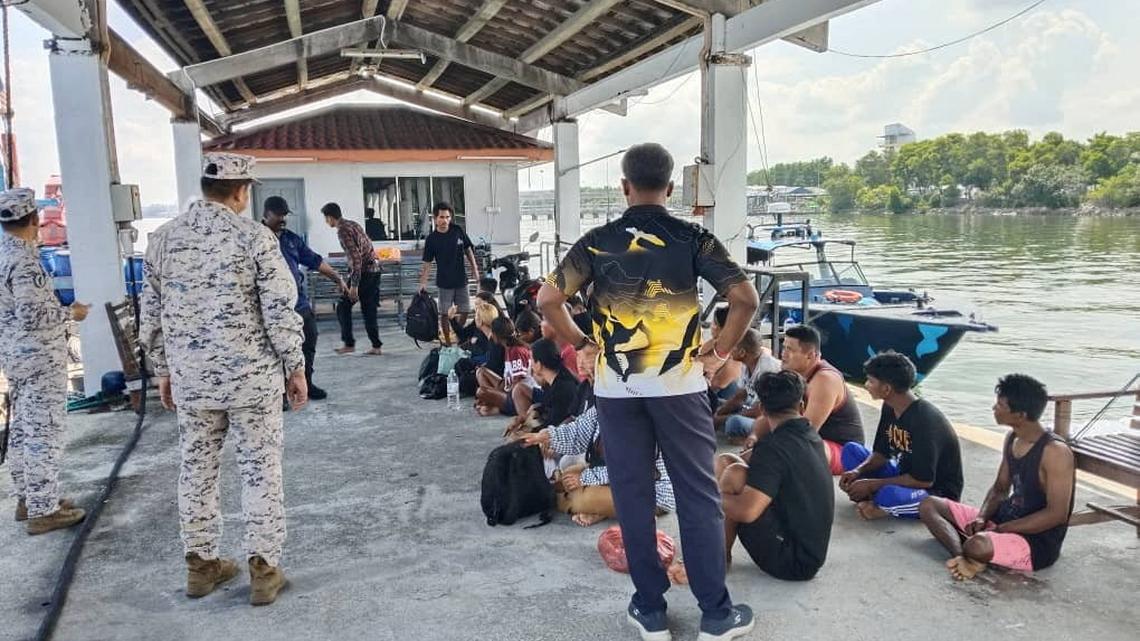Malaysia searches for 14 missing after migrant boat capsizes 