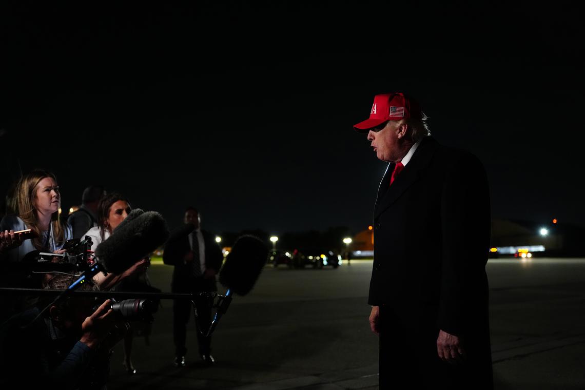 President Donald Trump speaks to reporters after disembarking Air Force One at Joint Base Andrews in Maryland, on Sunday, April 12, 2026. (Tierney L. Cross/The New York Times)