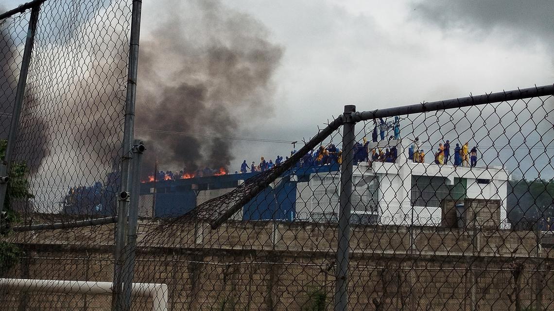 Venezuelan inmates take to prison roof to protest shootings, abuse 
