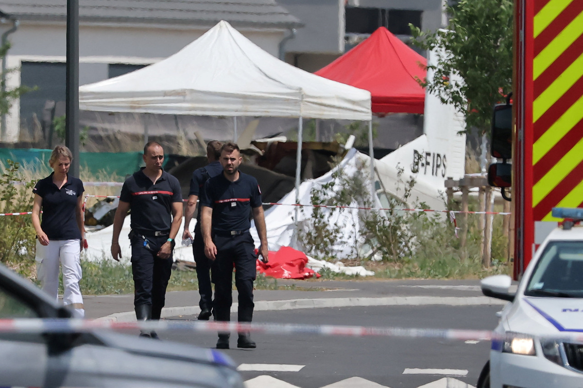 Rescuers work at the site of a plane crash in Tomblaine, France, June 28, 2026. REUTERS/Christian Hartmann