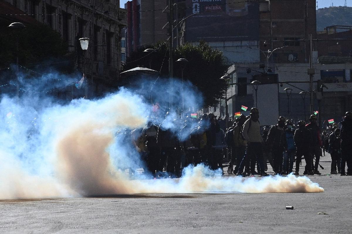 A demonstrator from mining unions throws a tear gas canister as they protest against President Rodrigo Paz's government amid an ongoing economic and fuel crisis, in La Paz, Bolivia, May 14, 2026. REUTERS/Claudia Morales