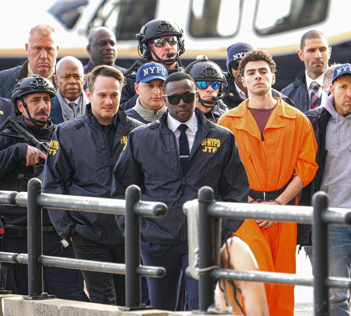 NEW YORK, NY - DECEMBER 19: Luigi Mangione, the suspect indicted in the murder of UnitedHealthcare CEO Brian Thompson, and New York City Mayor Eric Adams are seen arriving at the South Street Helipad in New York City on December 19, 2024 after being extradited from Pennsylvania.  (Photo by XNY/Star Max/GC Images)