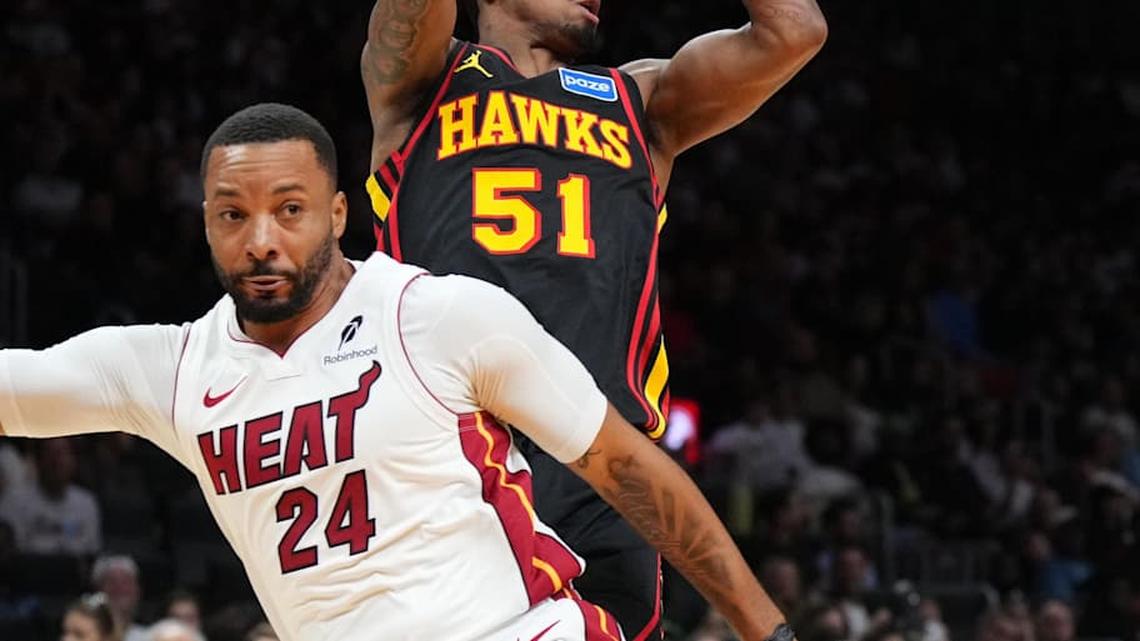  Apr 12, 2026; Miami, Florida, USA; Atlanta Hawks guard Keshon Gilbert (51) looks to pass against Miami Heat guard Norman Powell (24) during the first half at Kaseya Center. Mandatory Credit: Jim Rassol-Imagn Images | Jim Rassol-Imagn Images 