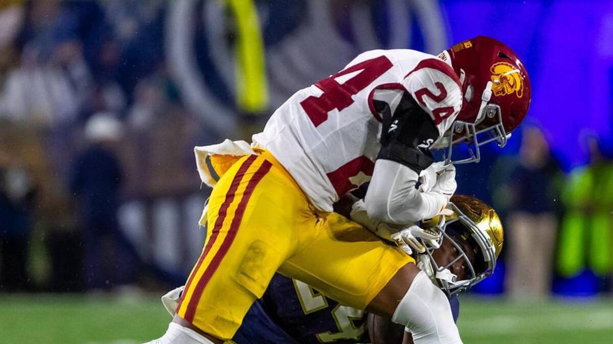  Oct 18, 2025; South Bend, Indiana, USA; Southern California Trojans safety Christian Pierce (24) hits Notre Dame Fighting Irish running back Jadarian Price (24) during the second half at Notre Dame Stadium. Mandatory Credit: Michael Caterina-Imagn Images | Michael Caterina-Imagn Images 