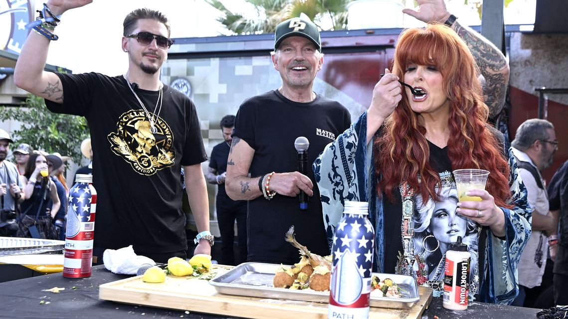 Chef Hunter Fieri, left, and Billy Bob Thornton, center, reacts as country aritst Wynonna Judd samples Thornton’s salmon dish during a celebrity cooking demonstration at the Guy Fieri Smokehouse during the second day of the Stagecoach Country Music Festival in Indio on Saturday, April 25, 2026. (Photo by Will Lester, Inland Valley Daily Bulletin/SCNG)