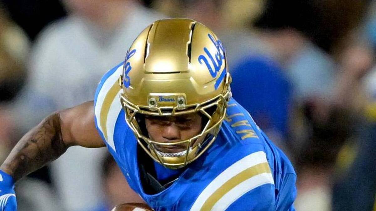  Nov 22, 2025; Pasadena, California, USA; Washington Huskies safety Rahshawn Clark (2) forces a fumble by UCLA Bruins wide receiver Mikey Matthews (7) during the first half the Rose Bowl. Mandatory Credit: Jayne Kamin-Oncea-Imagn Images | Jayne Kamin-Oncea-Imagn Images 