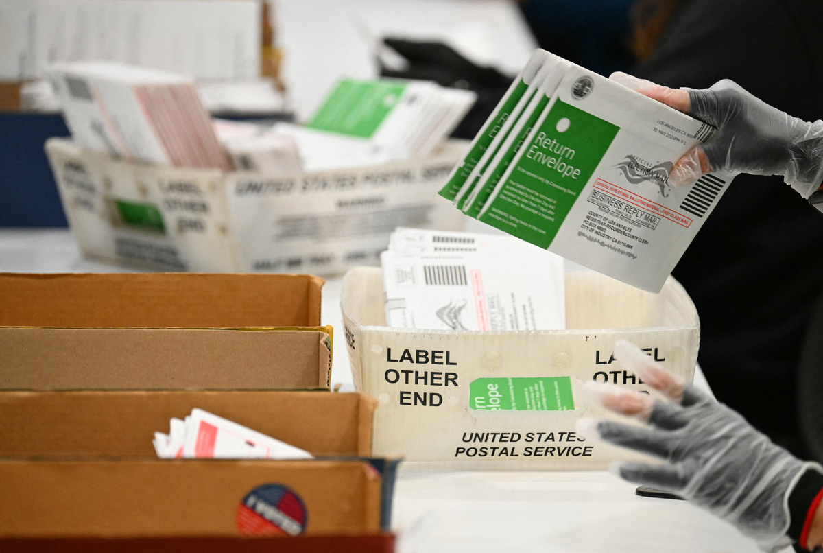  Election workers process mail-in ballots at the Los Angeles County Ballot Processing Center during California’s state primary election in the City of Industry, California, on June 2. 
