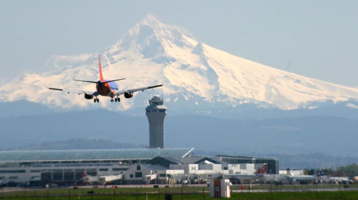 Tri-Cities, WA woman is accused of shooting a gun inside the Portland International Airport on Nov. 14.