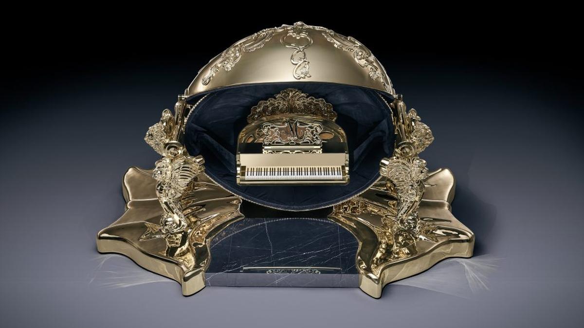 The golden piano egg. (Courtesy of goldfinchpianos.com via SWNS). 
