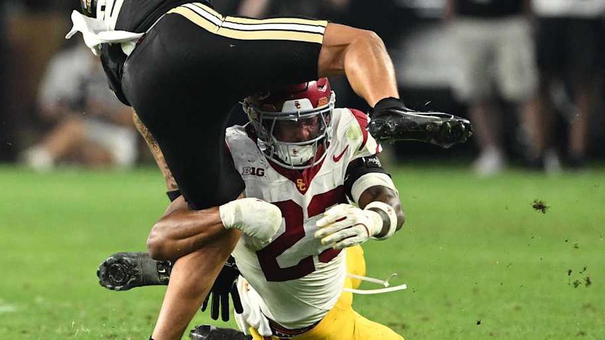 Sep 13, 2025; West Lafayette, Indiana, USA; Purdue Boilermakers wide receiver Michael Jackson III (2) is tackled by USC Trojans linebacker Desman Stephens II (23) during the second half at Ross-Ade Stadium. Mandatory Credit: Marc Lebryk-Imagn Images | Marc Lebryk-Imagn Images 