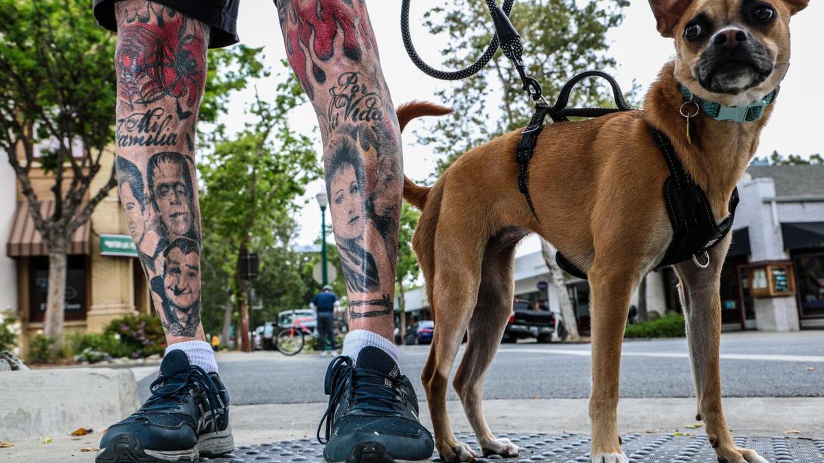 Claremont, CA - May 12: Wayne the Flame with his dog Peaches gives his views regarding the race for Governor in Claremont, CA on Tuesday, May 12, 2026. (Robert Gauthier/Los Angeles Times)