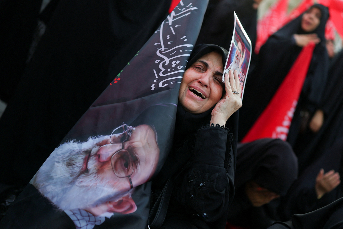 A woman reacts on the day of a public farewell ceremony to pay respect to late Supreme Leader Ayatollah Ali Khamenei, who was killed on February 28 in Israeli and U.S. airstrikes, at the Imam Khomeini Grand Mosalla, in Tehran, Iran July 4, 2026.  REUTERS/Mohammed Salem