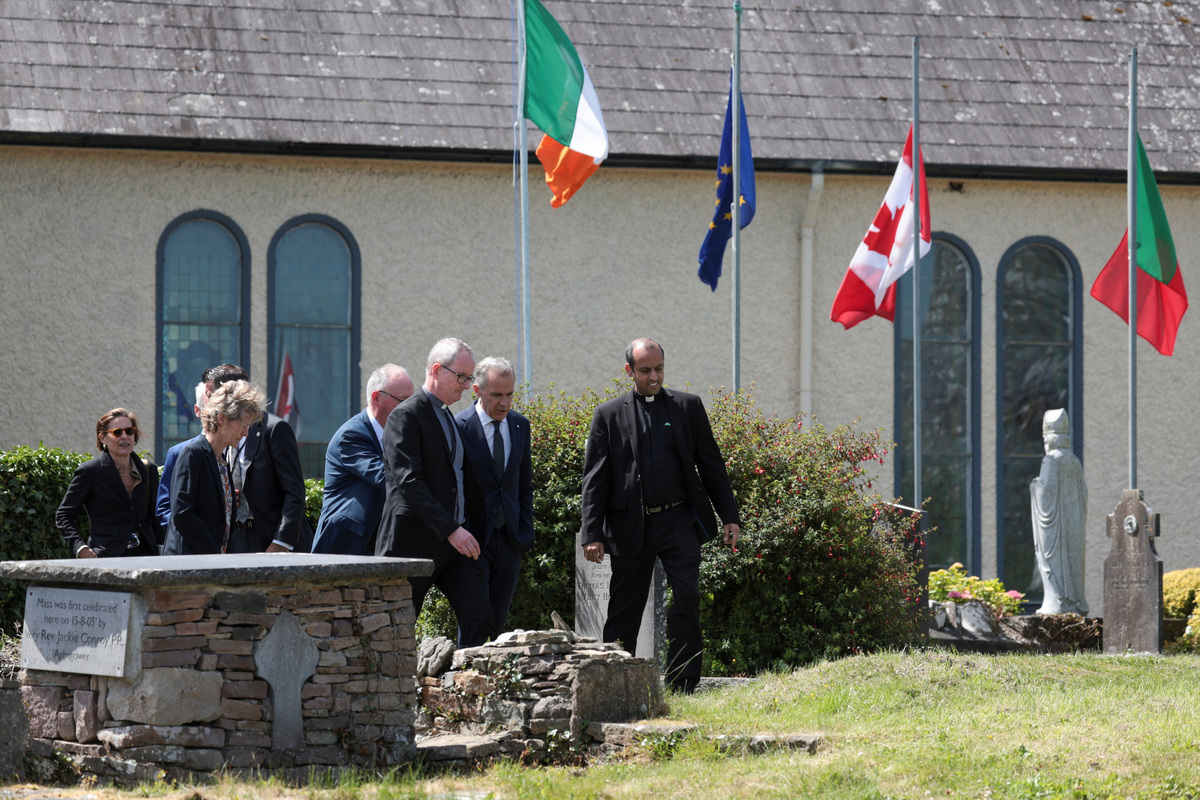 Canadian Prime Minister Mark Carney and his wife Diana Fox Carney visit his ancestral village Aghagower, Ireland, June 14, 2026. REUTERS/Emilija Jefremova