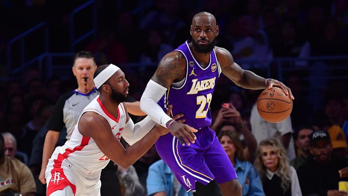  LeBron James and Josh Okogie | Gary A. Vasquez-Imagn Images 