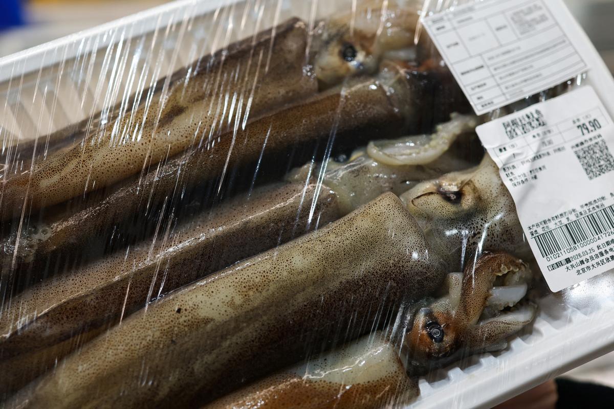 A pack of Argentine squid is placed in a fridge at a seafood section at a supermarket in Beijing, China March 26, 2026. REUTERS/Tingshu Wang