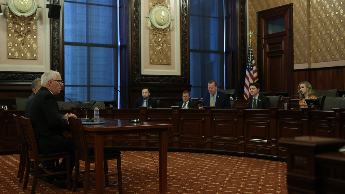 Michael C. Burns, left, answers questions from state senators during an appointments hearing for the Illinois Prisoner Review Board at the State Capitol, May 28, 2026, in Springfield. (John J. Kim/Chicago Tribune/TNS)