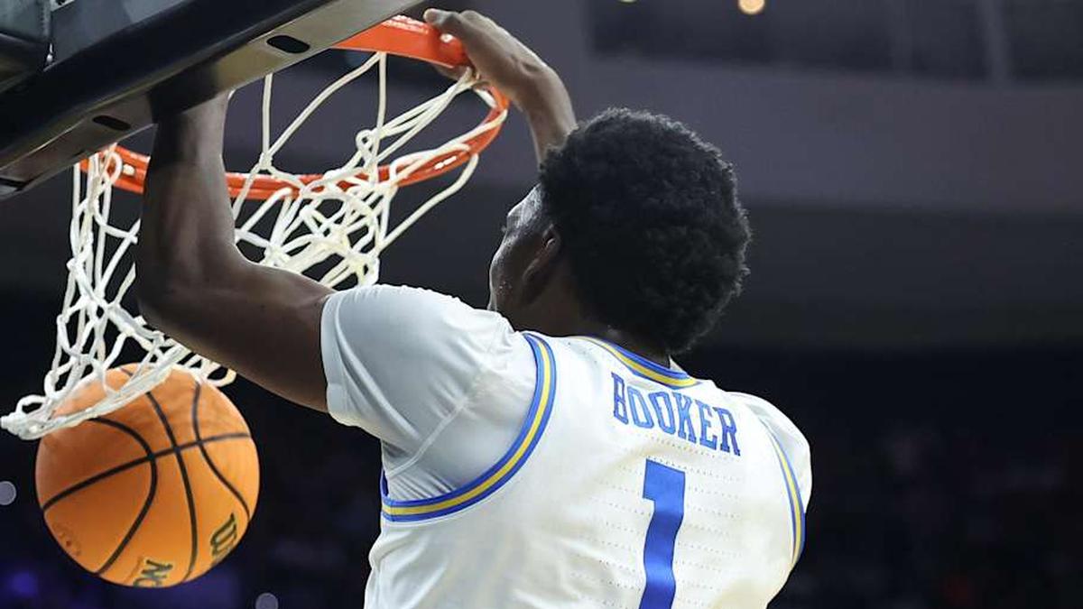  Mar 20, 2026; Philadelphia, PA, USA; UCLA Bruins center Xavier Booker (1) dunks the ball against the UCF Knights in the second half during a first round game of the men's 2026 NCAA Tournament at Xfinity Mobile Arena. Mandatory Credit: Bill Streicher-Imagn Images | Bill Streicher-Imagn Images 