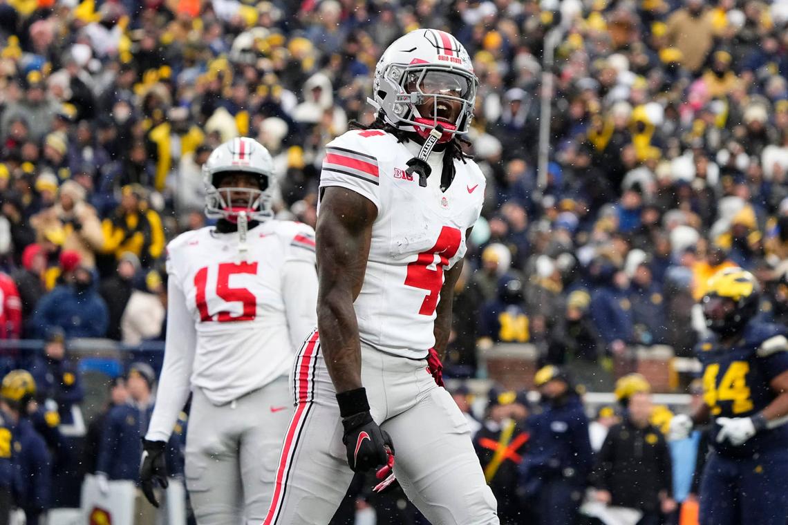  Ohio State Buckeyes wide receiver Jeremiah Smith (4) celebrates a touchdown during the NCAA football game against the Michigan Wolverines at Michigan Stadium in Ann Arbor, Mich. on Nov. 29, 2025. 