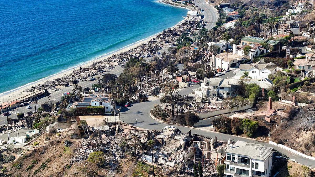Homes in the hills above the Pacific Coast Highway sit in ruins after being burned in the Palisades Fire near Malibu Jan. 17.