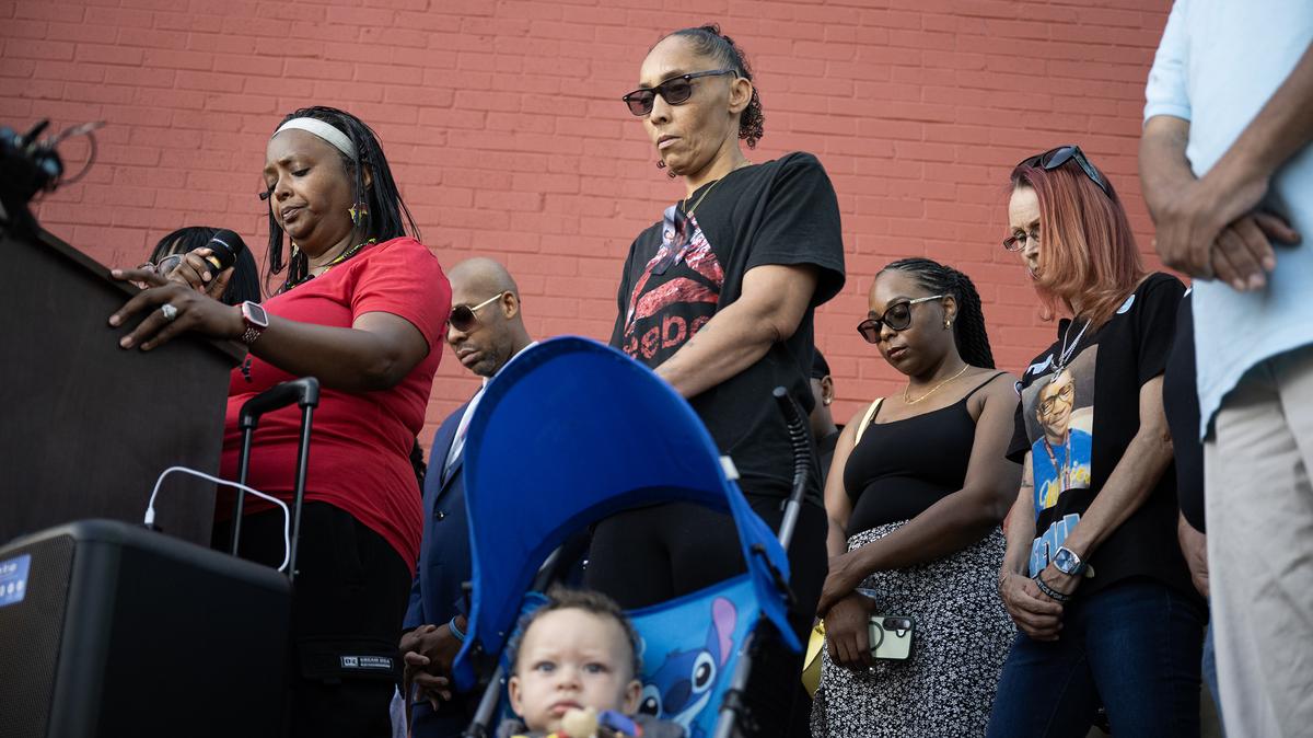 MiDian Shofner, CEO of The Epitome of Black Excellence and Partnership, left, Veronica Seabron, mother of Jalin Seabron, who died in 2025 after being shot by a Douglas County Sheriff's deputy, center, among others, hold a moment of silence for Elijah McClain’s mother, Sheneen McClain, during a press conference in response to the reversal of convictions connected to the 2019 death of Elijah McClain, on Friday, June 5, 2026, outside The Epitome of Black Excellence and Partnership on Welton Street in Denver. (Timothy Hurst/The Denver Post/TNS)