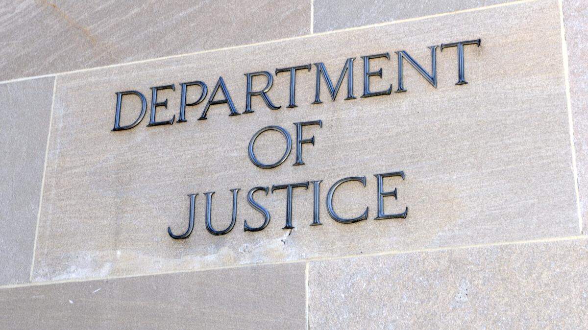A U.S. Department of Justice sign.