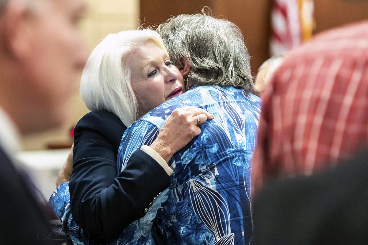  Former Mesa County Clerk and Recorder Tina Peters, left, hugs Pastor Dave Bryan of the Church of Glad Tidings, who testified on Peters’ behalf during a sentencing hearing for her election interference case at the Mesa County District Court Thursday, Oct. 3, 2024, in Grand Junction, Colo. (Larry Robinson/The Grand Junction Daily Sentinel via AP) 
