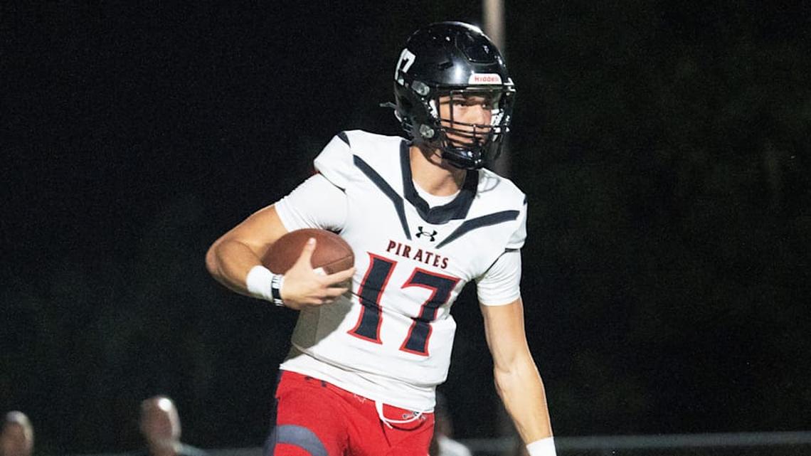 Logan Flaherty, the quarterback of Port Charlotte eludes a Dunbar defender during a game at Dunbar on Friday, Oct. 10, 2025. Port Charlotte won. | Andrew West/The News-Press/USA Today Network / USA TODAY NETWORK via Imagn Images 