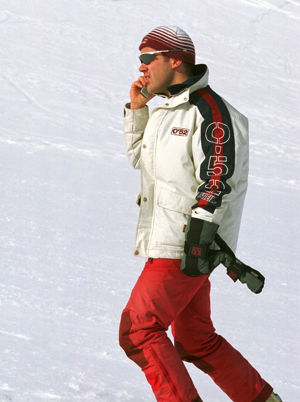  A snowboarder talks on his GSM mobile phone on the Stubai Glacier in Austria on February 7, 2001.
