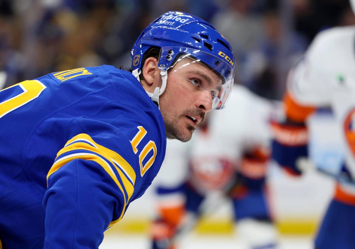  Buffalo Sabres center Sam Carrick (10) waits for a face-off. Timothy T. Ludwig-Imagn Images
