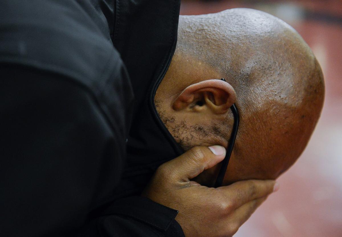 Jonathan Butler puts his head in his hands as he waits for a meeting Nov. 5, 2015, in Jesse Hall. Butler used social media updates to help notify his friends and followers that he was still OK throughout his hunger strike.