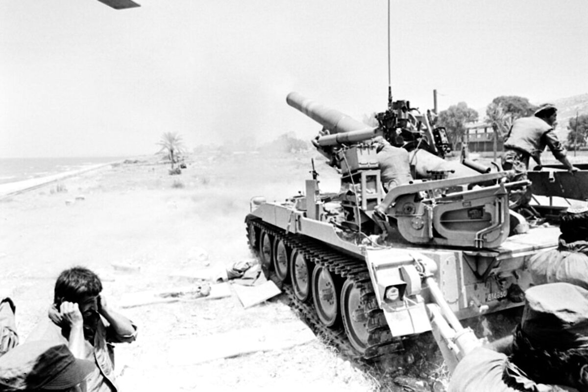  Israeli troops cover their ears as they fire their American-made howitzer in June 1982. AP Photo/Harry Koundakjian 