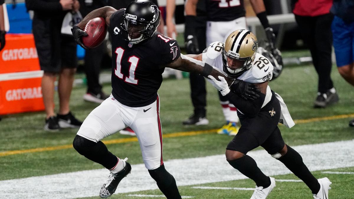 Atlanta Falcons wide receiver Julio Jones (11) runs against New Orleans Saints cornerback P.J. Williams (26) during the first half of an NFL football game, Sunday, Dec. 6, 2020, in Atlanta.