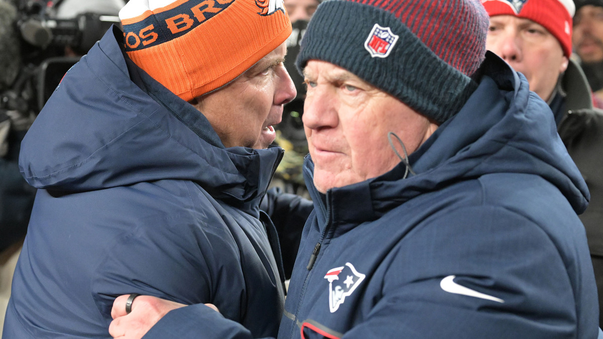 Denver Broncos head coach Sean Payton, left, meets with New England Patriots head coach Bill Belichick at midfield after the game at Empower Field at Mile High in Denver on Dec. 24, 2023. (RJ Sangosti/The Denver Post/TNS)