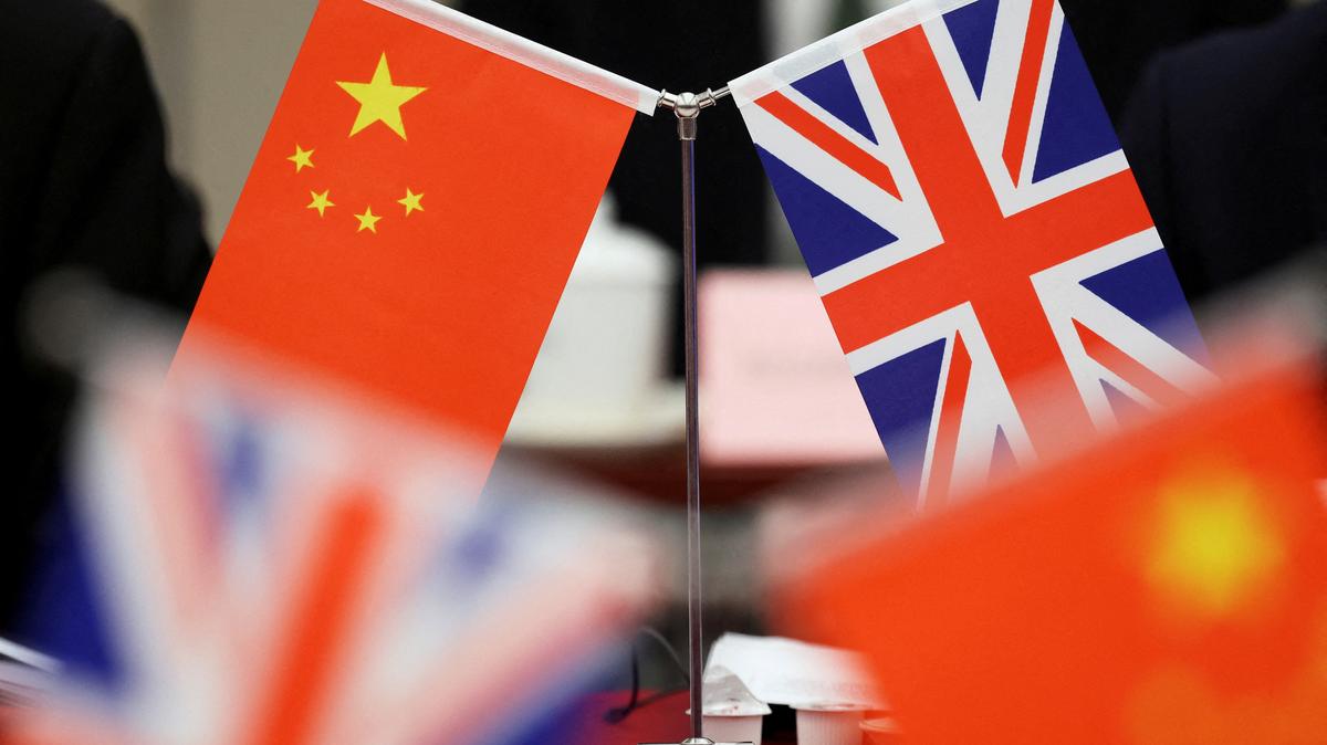 Flags of China and the Union Jack stand during the China-UK Energy Dialogue in Beijing, China March 17, 2025. REUTERS/Florence Lo/Pool