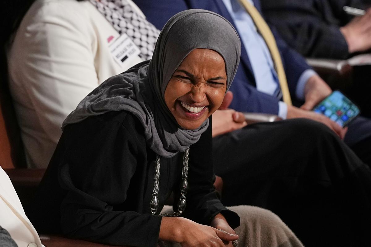  Rep. Ilhan Omar, D-Minn., listens as President Donald Trump delivers the State of the Union address to a joint session of Congress in the House chamber at the U.S. Capitol in Washington on February 24, 2026. 