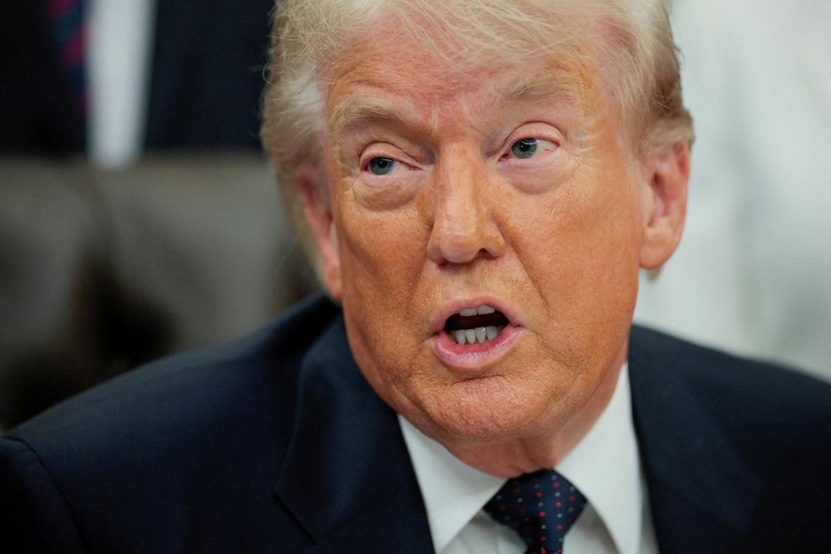 FILE PHOTO: U.S. President Donald Trump speaks during an event to sign a memorandum in the Oval Office at the White House in Washington, D.C., U.S., May 5, 2026. REUTERS/Evan Vucci/File Photo
