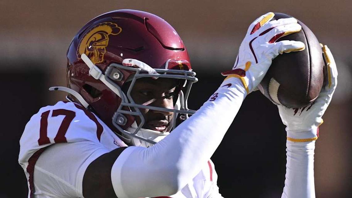  Oct 19, 2024; College Park, Maryland, USA; Southern California Trojans cornerback DeCarlos Nicholson (17) warms cup before the game against the Maryland Terrapins at SECU Stadium. Mandatory Credit: Tommy Gilligan-Imagn Images | Tommy Gilligan-Imagn Images 