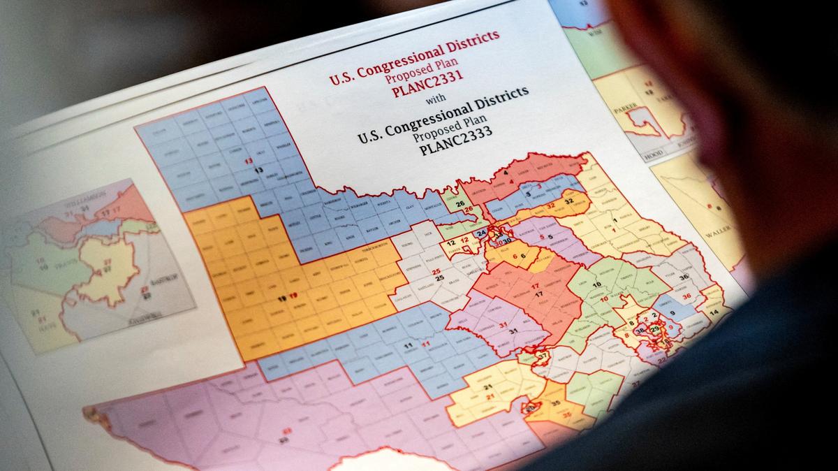 FILE PHOTO: State Representative Matt Morgan (R-TX) holds a map of the new proposed congressional districts in Texas, during a legislative session as Democratic lawmakers, who left the state to deny Republicans the opportunity to redraw the state's 38 congressional districts, begin returning to the Texas State Capitol in Austin, Texas, U.S. August 20, 2025. REUTERS/Sergio Flores/File Photo
