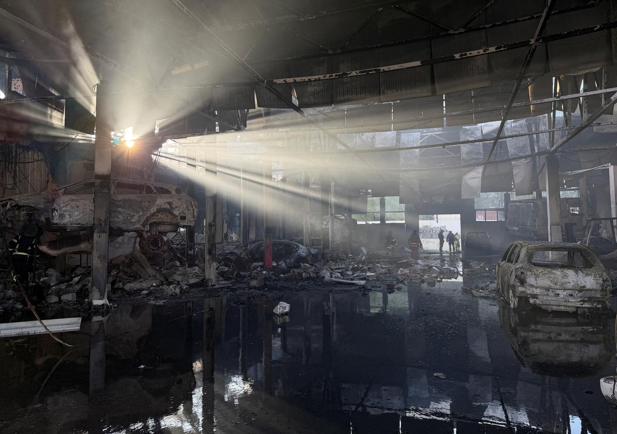 Rescuers work at a site of a Russian air strike, amid Russia's attack on Ukraine, in Zaporizhzhia, Ukraine May 5, 2026. Picture taken with a mobile phone. REUTERS/Serhii Chalyi
