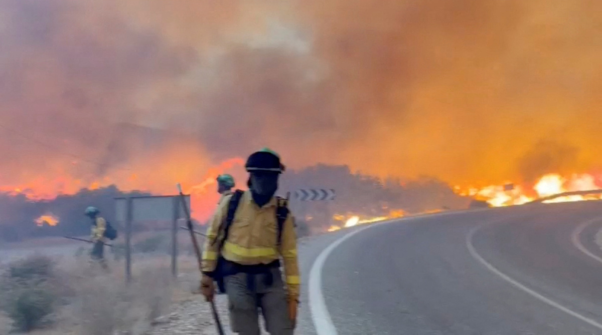 Emergency personnel work during a wildfire in Almeria, Spain, in this screengrab taken from a handout video released on July 10, 2026. @Plan_INFOCA via X/Handout via REUTERS