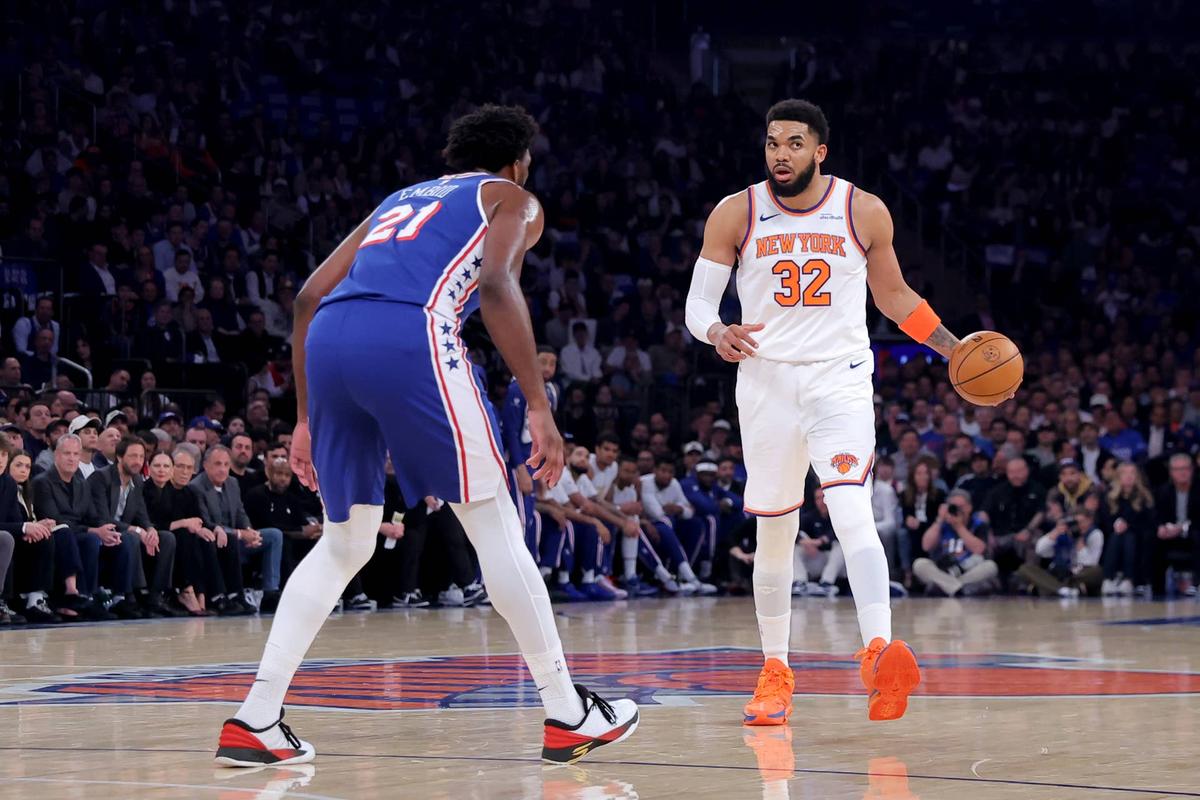  May 4, 2026; New York, New York, USA; New York Knicks center Karl-Anthony Towns (32) controls the ball against Philadelphia 76ers center Joel Embiid (21) during the first quarter of game one of the eastern conference semifinal round of the 2026 NBA Playoffs at Madison Square Garden. Mandatory Credit: Brad Penner-Imagn Images 