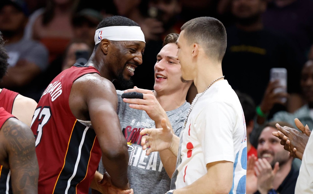  Mar 10, 2026; Miami, Florida, USA; Miami Heat center Bam Adebayo (13) celebrates with guards Pelle Larsson and Tyler Herro after becoming the NBA's second highest scorer of points in a game against the Wshington Wizards at Kaseya Center. Mandatory Credit: Rhona Wise-Imagn Images 